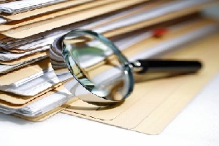 magnifying glass with files