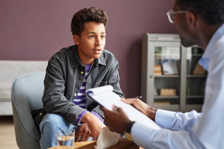 teen talking to professional